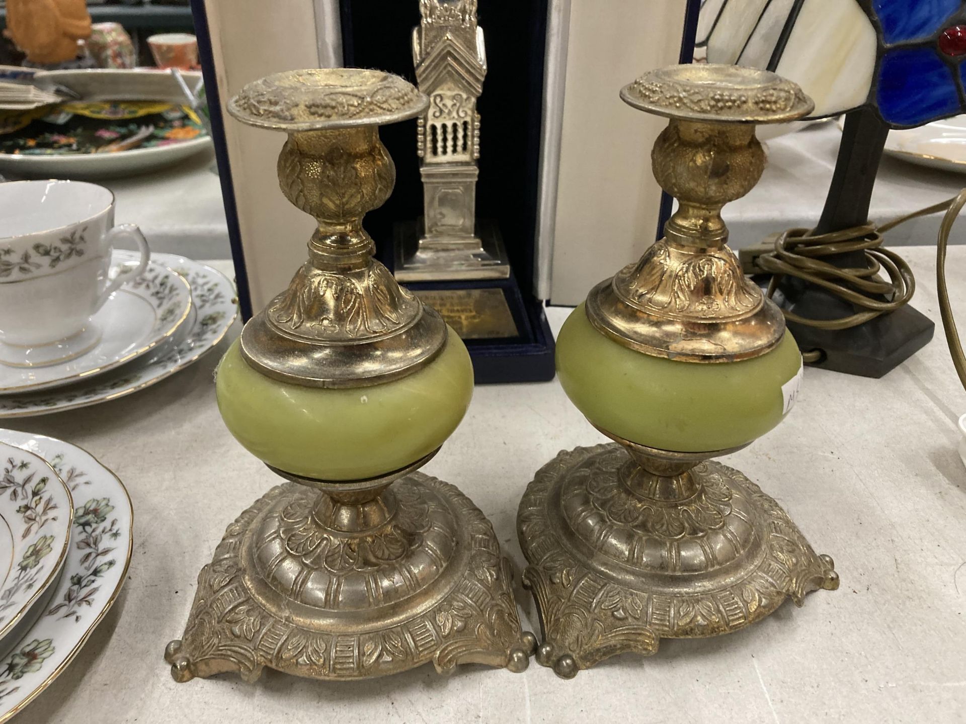 A PAIR OF VINTAGE SILVER PLATED AND ONYX CANDLESTICKS