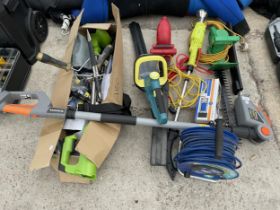 A LARGE ASSORTMENT OF GARDEN TOOLS TO INCLLUDE ELECTRIC HEDGE TRIMMERS AND STRIMMERS ETC