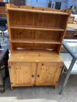 A MODERN PINE DRESSER COMPLETE WITH PLATE RACK, 36" WIDE