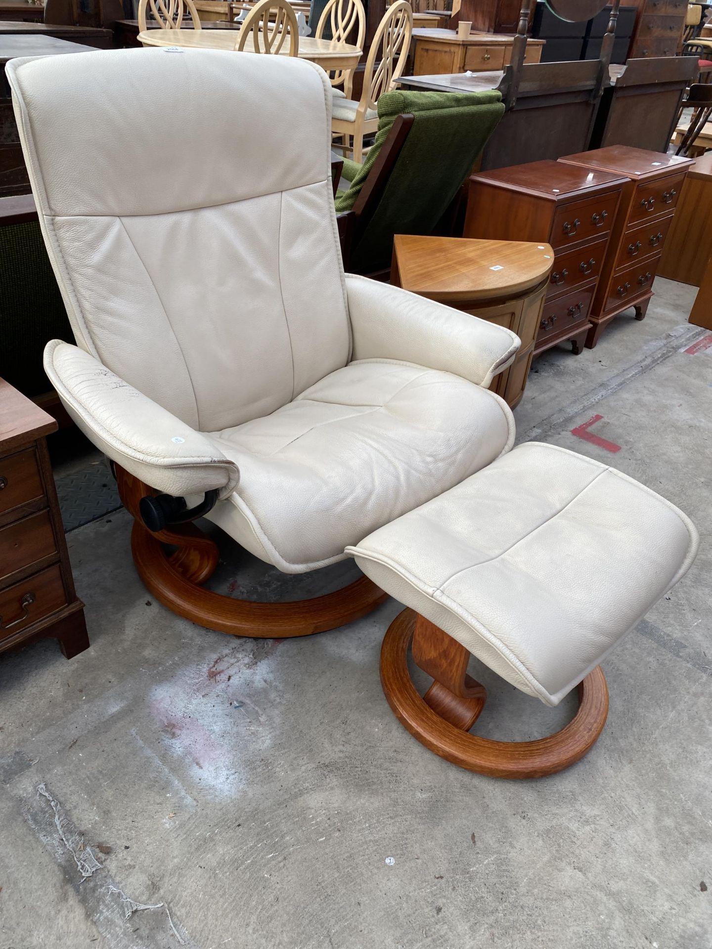 A STRESSLESS RECLINING SWIVEL CHAIR AND MATCHING STOOL