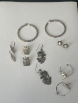 A BAG OF SILVER EARRINGS