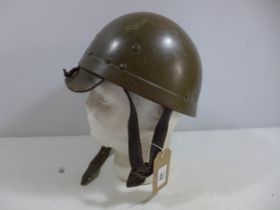 A MILITARY HELMET AND LINER, INSIDE MARKED RH OF CO 54C