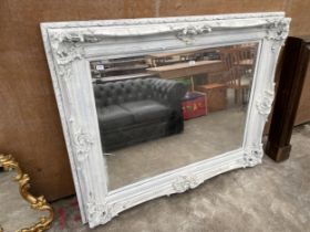 A LARGE MODERN WHITE PAINTED GILT FRAMED WALL MIRROR, 63 X 53", MIRROR A/F