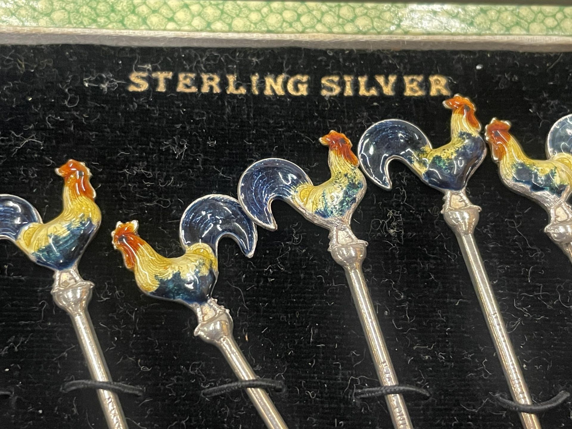 A CASED SET OF STERLING SILVER AND ENAMEL COCKEREL COCKTAIL STICKS - Image 2 of 4