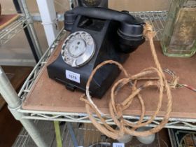 A VINTAGE BAKELITE DIAL TELEPHONE