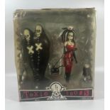 A 2004 MEZCO BOXED TOXIC TOONS THE BODY BAG BROTHERS AND MISS CERY GOTHIC FIGURES, 28 X 23 CM