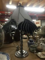 A CHROME EFFECT TABLE LAMP WITH TIFFANY STYLE SHADE