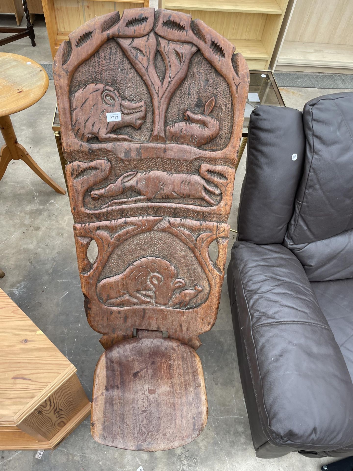 AN AFRICAN FOLDING TRIBAL CHAIR WITH WILD ANIMAL CARVINGS TO BACK - Image 2 of 3