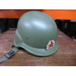 A RUSSIAN TANK HELMET WITH LINER AND BADGE