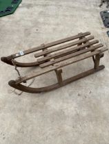 A VINTAGE WOODEN CHILDS SLEDGE