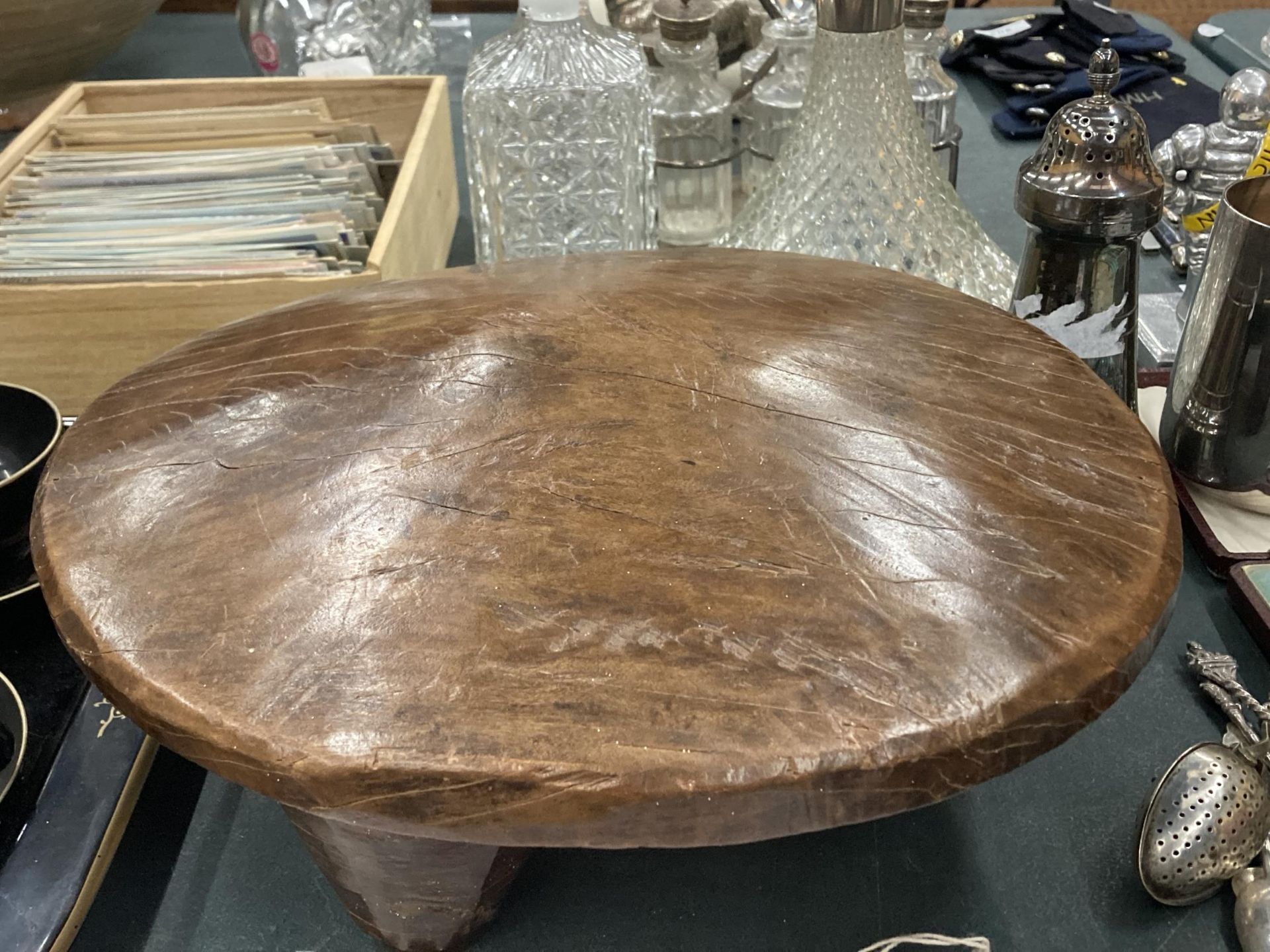 A CARVED INDIAN OAK FOOTSTOOL