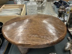 A CARVED INDIAN OAK FOOTSTOOL