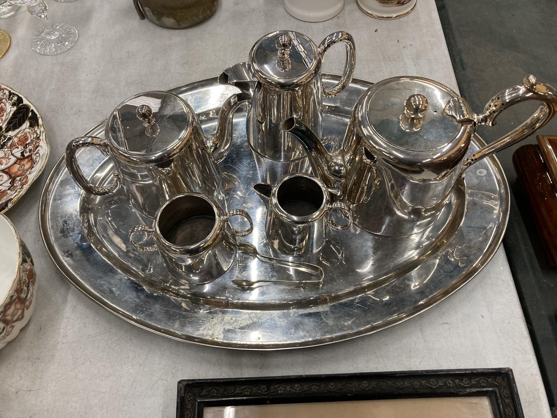 A VINTAGE SILVER PLATED TEA SET AND TRAY