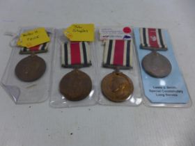 A FOUR SPECIAL CONSTABULARY LONG SERVICE MEDALS RANGING FROM THE REIGNS OF GEORGE V TO GEORGE VI