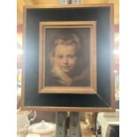A WOODEN FRAMED OLEOGRAPH PRINT OF A YOUNG GIRL