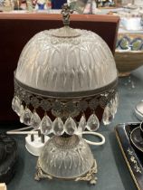 A VINTAGE GLASS AND METAL TABLE LAMP WITH ENGRAVED GLASS, CRYSTAL DROPS AND ANGEL FINIAL, HEIGHT