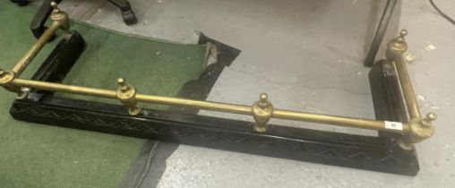 A VINTAGE CAST METAL AND BRASS FIRE FENDER