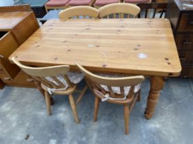 A MODERN PINE KITCHEN TABLE ON TURNED LEGS, 54 X 32" AND FOUR CHAIRS