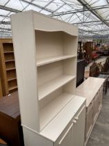 A MODERN CREAM DRESSER COMPLETE WITH RACK, 36" WIDE