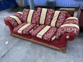 A MODERN SCROLL END SETTEE ON PINE BASE WITH APPLIED BARLEYTWIST DECORATION