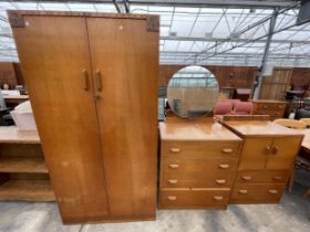 AN OAK G. PLAN E.GOMME THREE PIECE BEDROOM SUITE COMPRISING OAK TALL BOY, DRESSING CHEST AND TWO