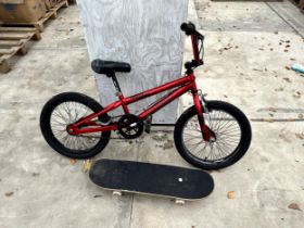 A CHILDS BMX BIKE AND A SKATEBOARD