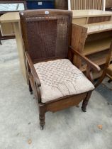 A LEVESON & SONS (LONDON) COMMODE CHAIR WITH DROP ARMS AND PULL-OUT COMMODE SECTION FROM THE BACK