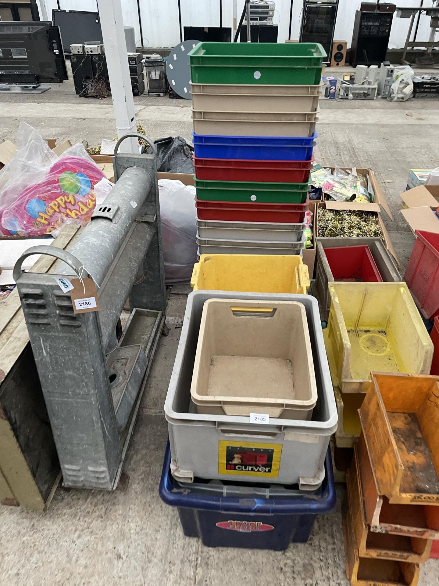 AN ASSORTMENT OF PLASTIC STORAGE BOXES