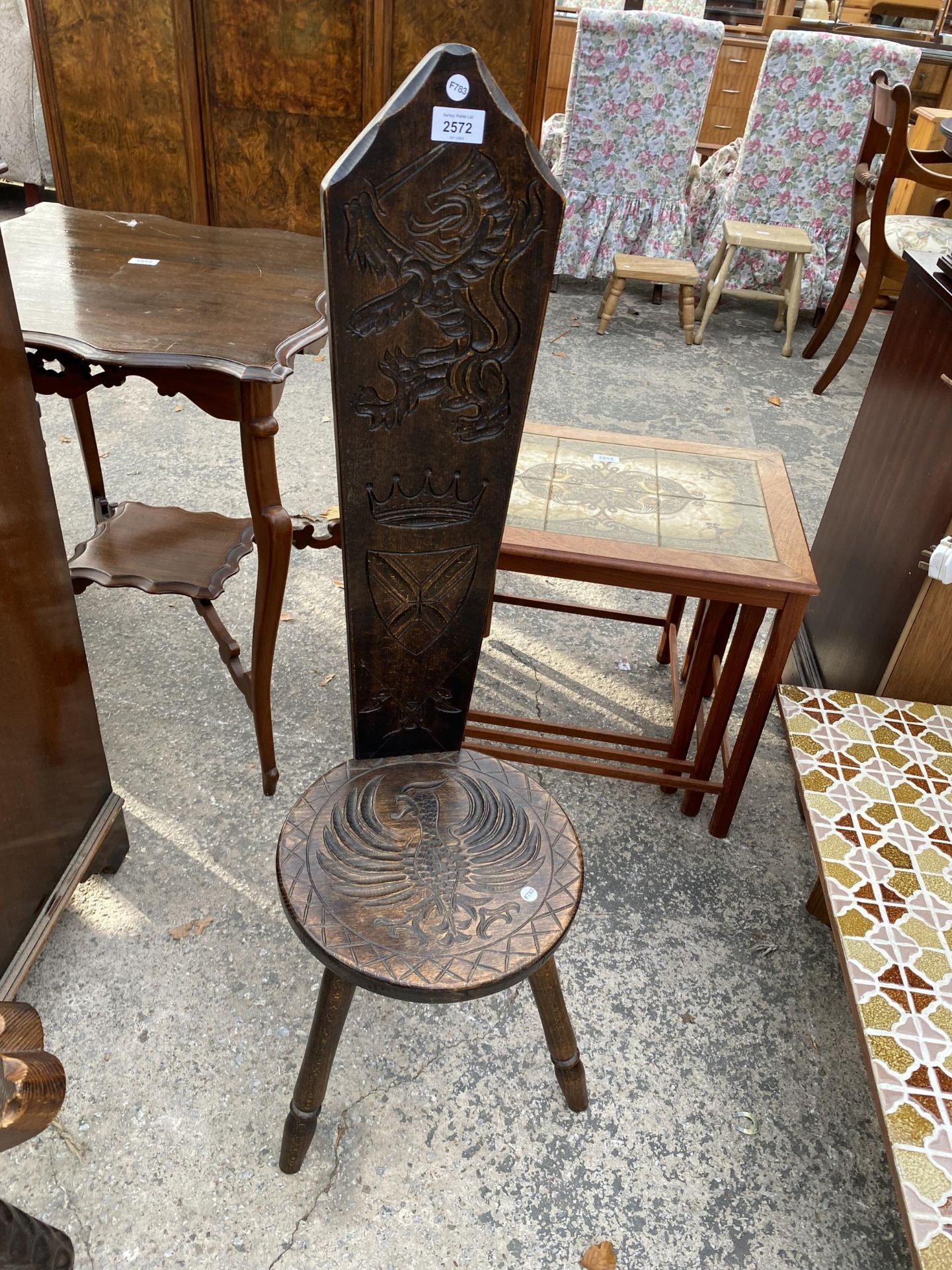 A CARVED BEECH SPINNING STOOL, CARVED BY HAND THE STUDIO OF ART AND ANTIQUITY, TORQUAY, DEVON
