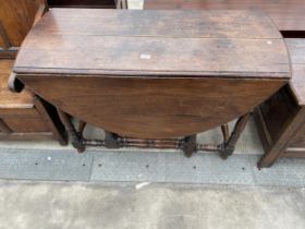 A GEORGE III OAK OVAL DINING TABLE, 52 X 46" OPENED ON TURNED LEGS WITH TWO END DRAWERS