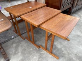 A RETRO TEAK NEST OF THREE TABLES STAMPED 'MADE IN DENMARK'