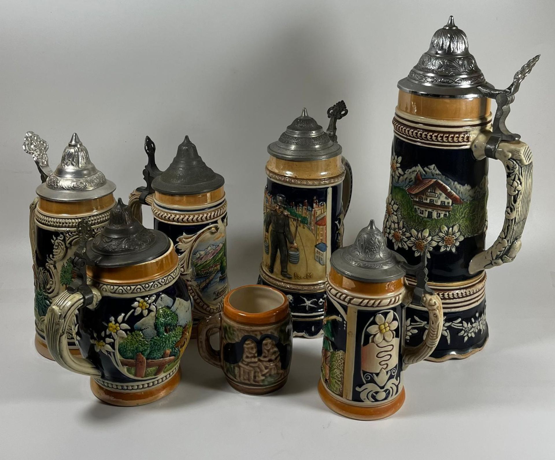 A COLLECTION OF SEVEN VINTAGE GERMAN BEER STEINS, LARGEST 28 CM - Image 2 of 3
