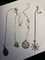 FOUR SILVER NECKLACES WITH PENDANTS