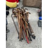 A LARGE ASSORTMENT OF VINTAGE WOODEN WALKING STICKS