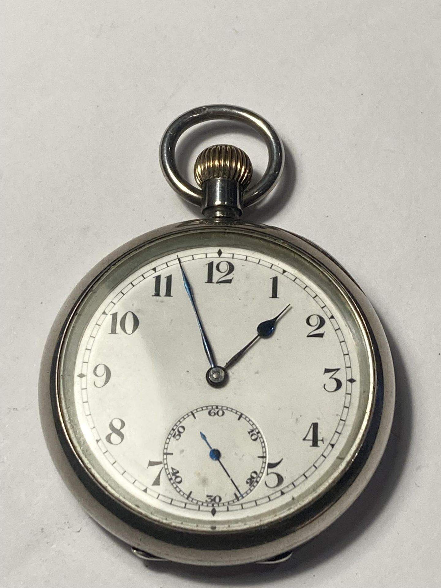 A SILVER POCKET WATCH WITH WHITE ENAMEL FACE SEEN WORKING BUT NO WARRANTY