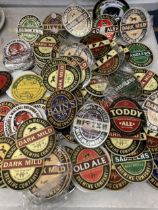 A COLLECTION OF PUB BEER BADGES / COASTERS ETC