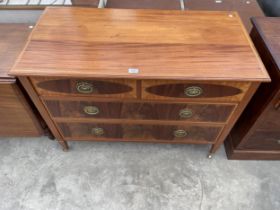 AN EDWARDIAN MAHOGANY AND INLAID CHEST OF TWO SHORT AND TWO LONG DRAWERS ON TAPERING LEGS, 42"