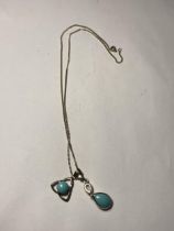 A MARKED SILVER CHAIN (NO CLASP) AND TWO SILVER AND TURQUOISE STONE PENDANTS