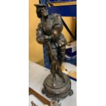 A LARGE BRONZE EFFECT SPELTER FIGURE OF A 16TH CENTURY ITALIAN MUSKETEER ON PEDESTAL, 30" HEIGHT