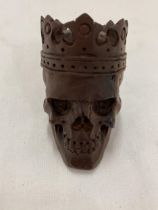 A WOODEN CARVED SKULL, HEIGHT 9CM