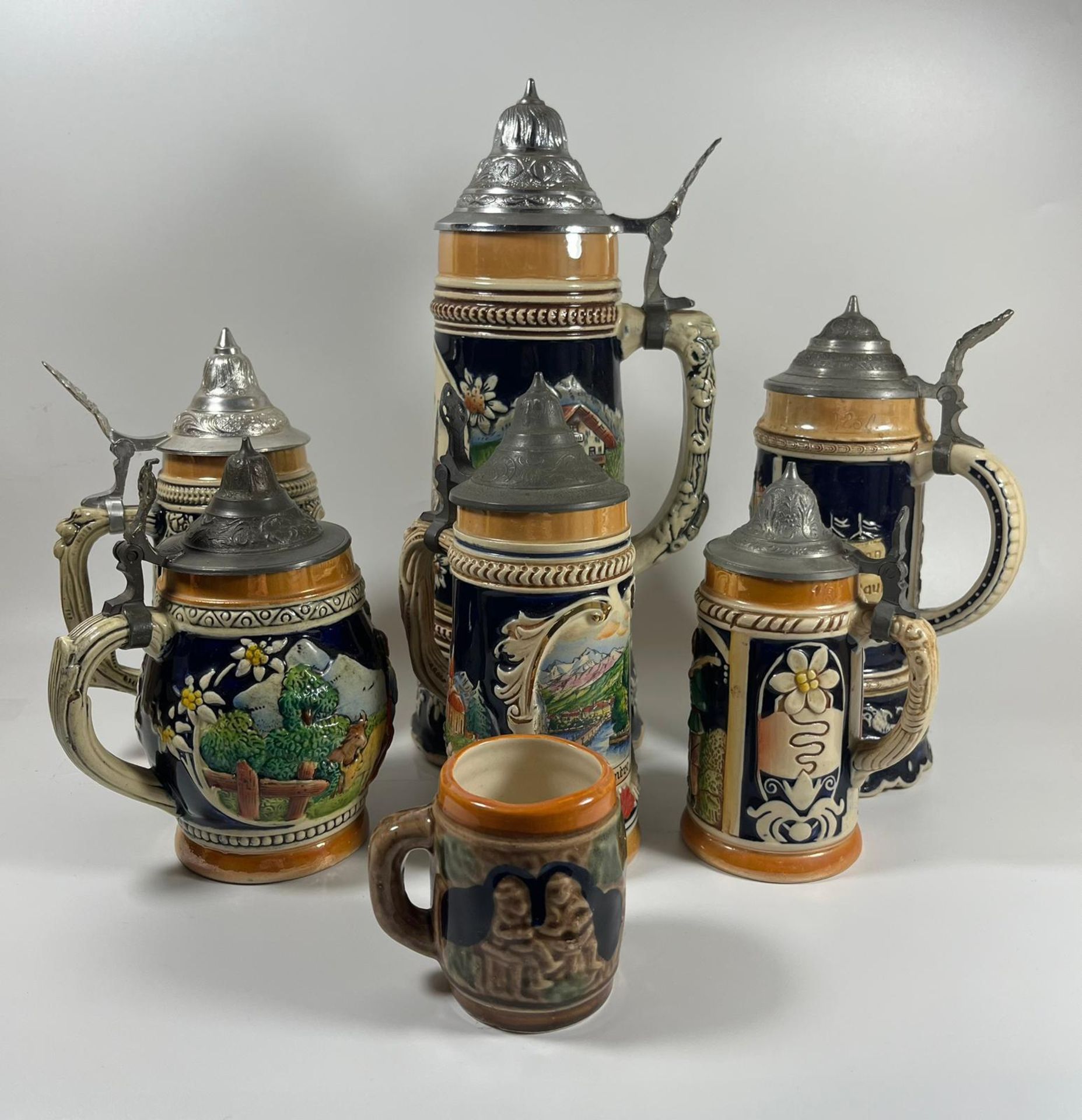 A COLLECTION OF SEVEN VINTAGE GERMAN BEER STEINS, LARGEST 28 CM - Image 3 of 3