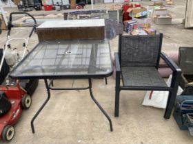 A SQUARE GLASS TOPPED BISTRO TABLE AND TWO CHAIRS