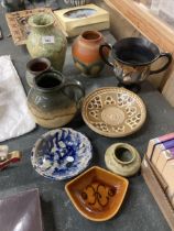 A COLLECTION OF STUDIO POTTERY TO INCLUDE JUGS, VASES AND BOWLS, SOME MARKED TO THE BASE