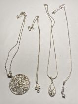 FOUR ASSORTED SILVER NECKLACES WITH PENDANTS