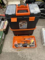 A TWO WHEELED STACKING TOOL BOX AND AN ASSORTMENT OF TOOLS TO INCLUDE PLIERS AND HAMMERS ETC