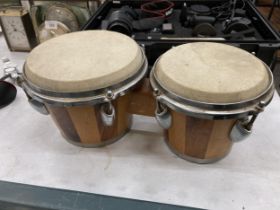 A PAIR OF WOODEN BONGO DRUMS