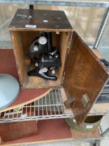A VINTAGE R J BECK LTD MICROSCOPE WITH WOODEN CARRY CASE