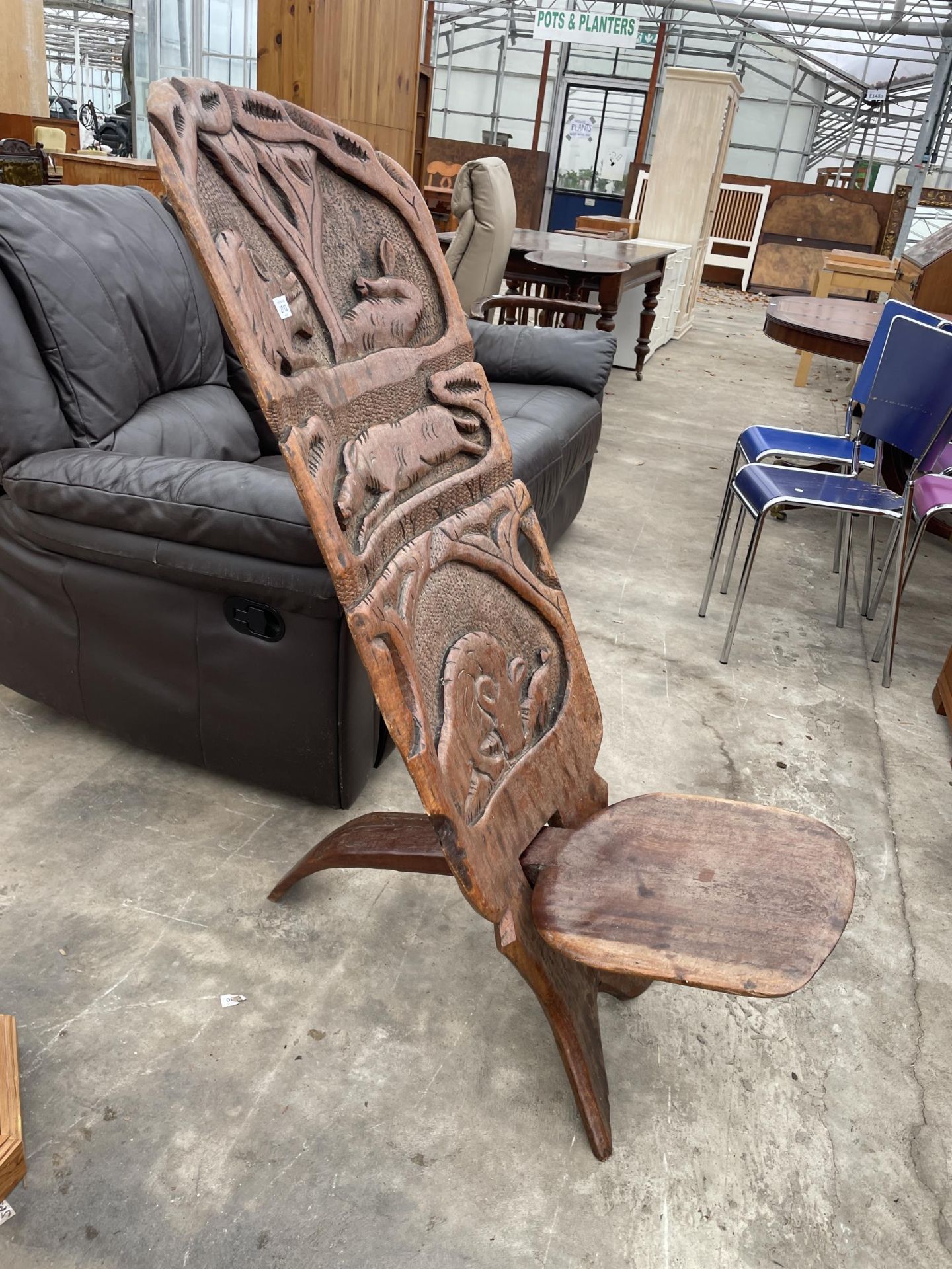 AN AFRICAN FOLDING TRIBAL CHAIR WITH WILD ANIMAL CARVINGS TO BACK - Image 3 of 3