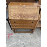 A MID 20TH CENTURY OAK BUREAU, 29" WIDE