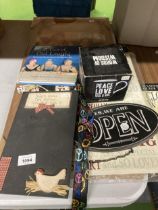 A MIXED LOT TO INCLUDE A BLAKBOARD, SIGNS, MUG, BOOK, ETC